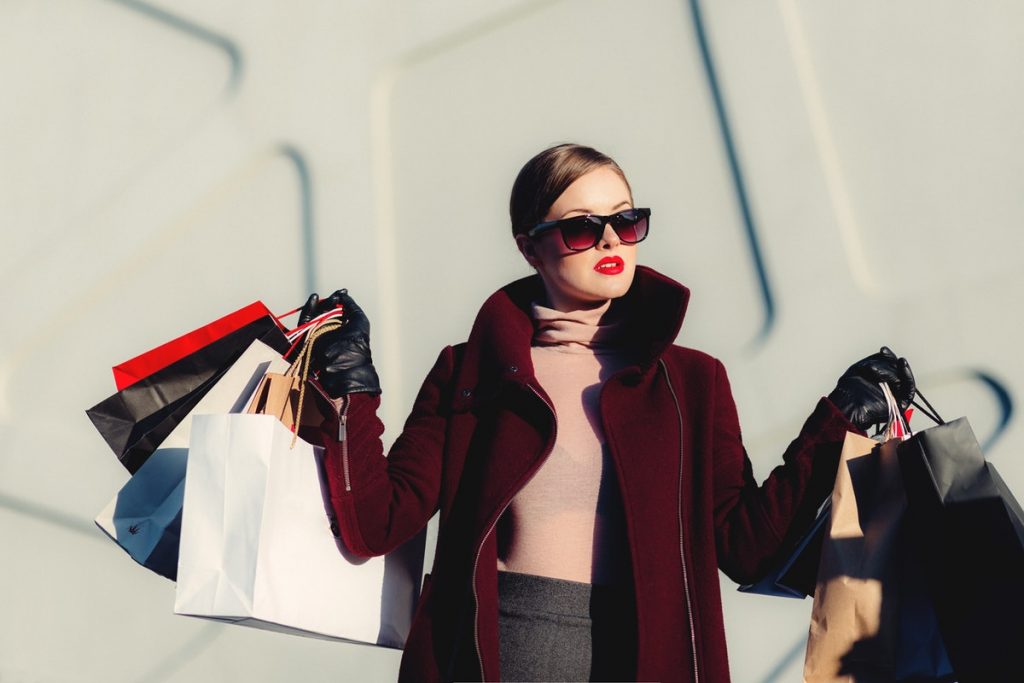 woman holding shopping bags