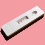 pregnancy test on pink background