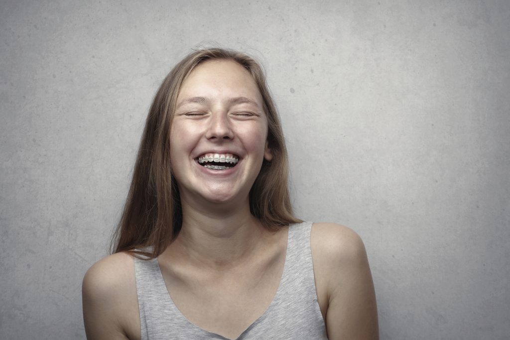 girl laughing with braces