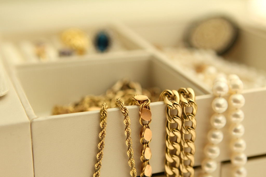 gold jewelry and pearls in box