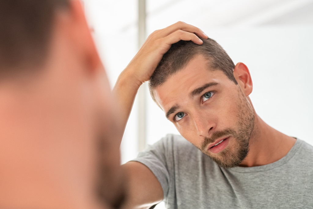 Man stressed about hair loss