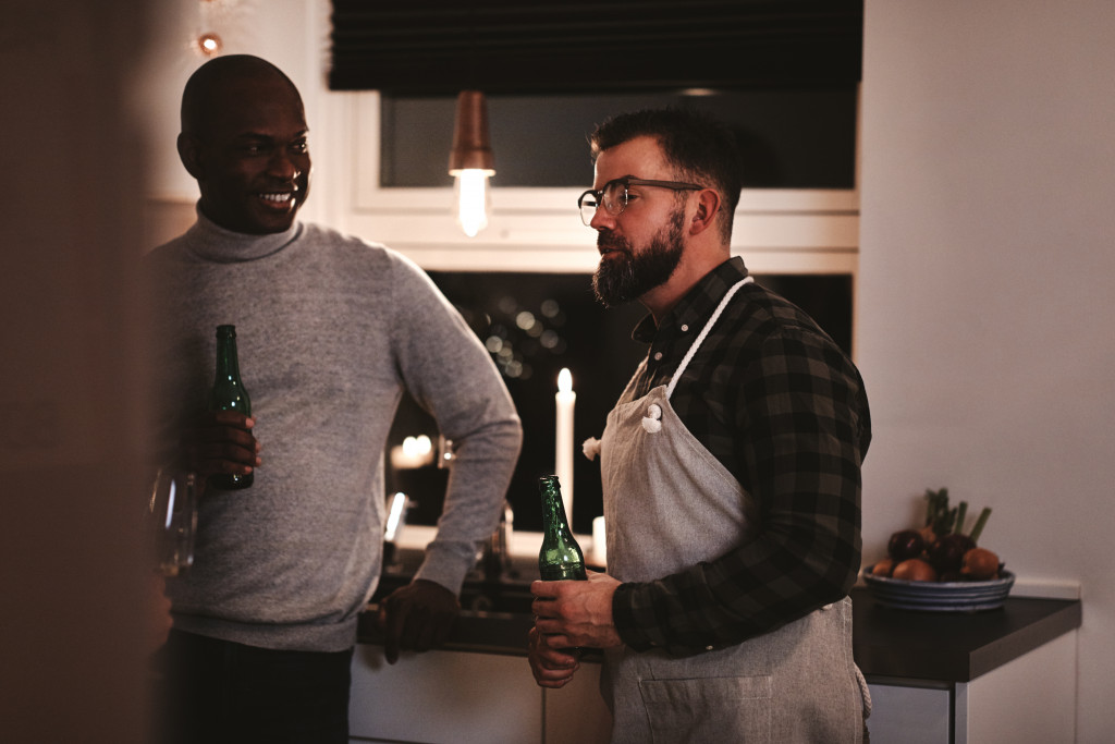 beers in a kitchen during a dinner party
